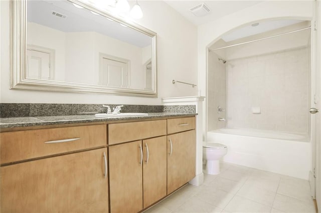 bathroom featuring tile patterned flooring, toilet, shower / bath combination, visible vents, and vanity