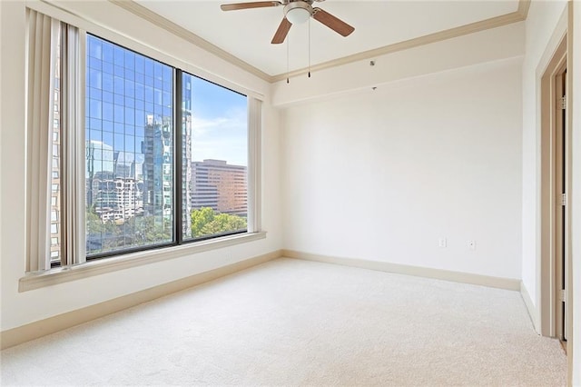 3445 Stratford Rd NE Unit 1605, Atlanta, GA 30326 - carpeted spare room with crown molding, a skyline view, ceiling fan, and baseboards