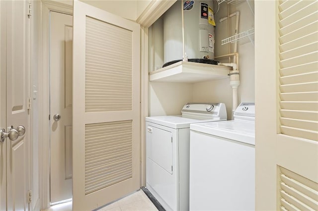 3445 Stratford Rd NE Unit 1605, Atlanta, GA 30326 - laundry room with water heater, separate washer and dryer, and light tile patterned floors