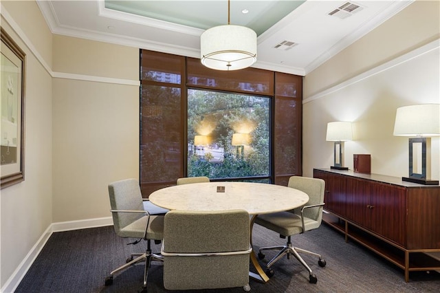 dining room featuring dark colored carpet, a tray ceiling, visible vents, and crown molding