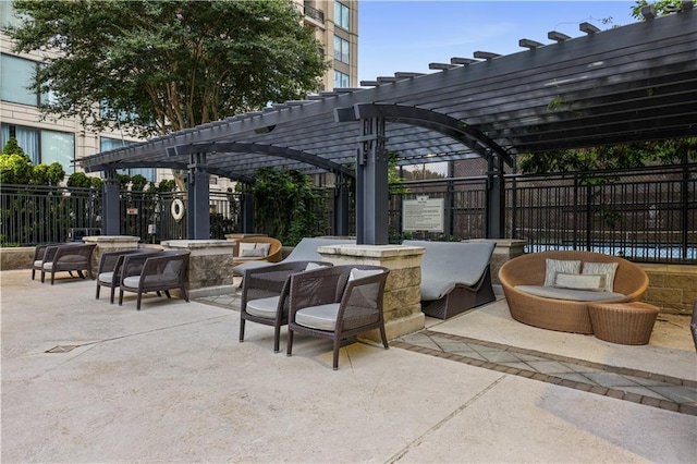 view of patio / terrace with fence and a pergola