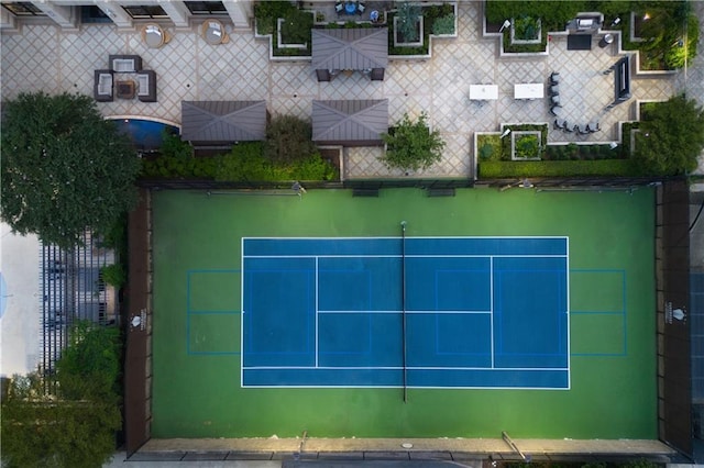 view of tennis court with fence