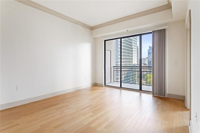 3445 Stratford Rd NE Unit 1605, Atlanta, GA 30326 - unfurnished room featuring light wood-type flooring, baseboards, ornamental molding, and a city view