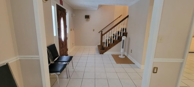 tiled entrance foyer with crown molding