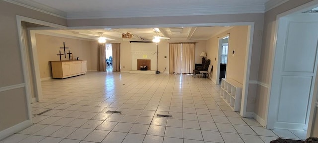 unfurnished living room with crown molding and light tile patterned floors