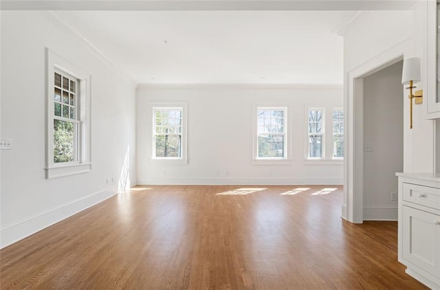 1585 S Ponce De Leon Ave NE Unit 20, Atlanta, GA 30307 - spare room with crown molding, wood finished floors, and baseboards