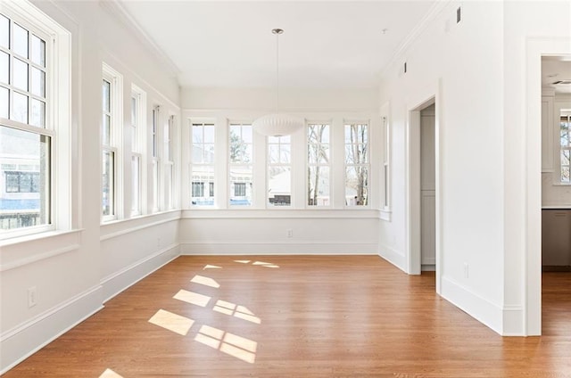 1585 S Ponce De Leon Ave NE Unit 20, Atlanta, GA 30307 - unfurnished sunroom with wood finished floors, baseboards, and ornamental molding