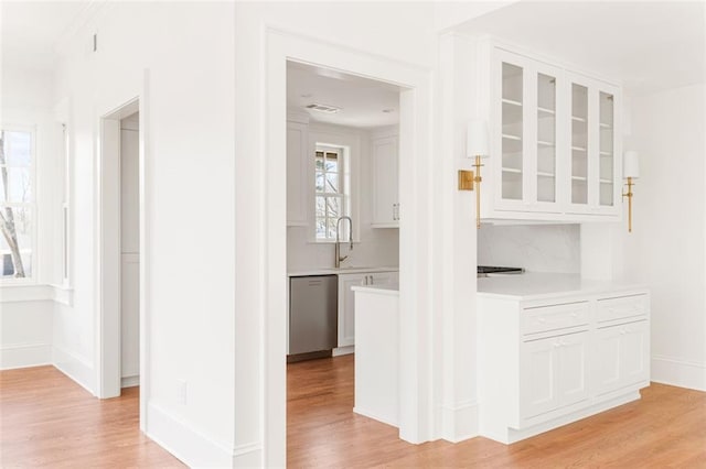 1585 S Ponce De Leon Ave NE Unit 20, Atlanta, GA 30307 - hallway featuring light wood-style flooring, a sink, and baseboards