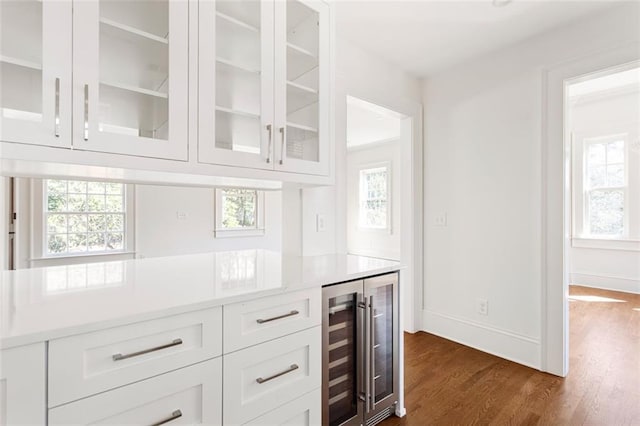 1585 S Ponce De Leon Ave NE Unit 20, Atlanta, GA 30307 - bar featuring beverage cooler, dark wood-style floors, and baseboards