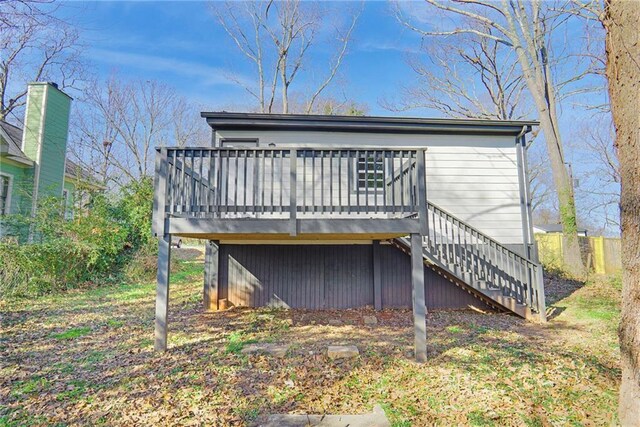 rear view of house with a wooden deck