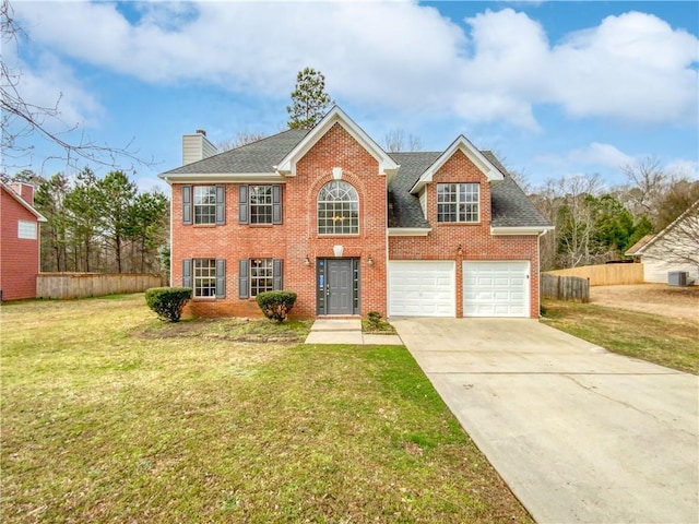 view of front facade featuring a front lawn and a garage