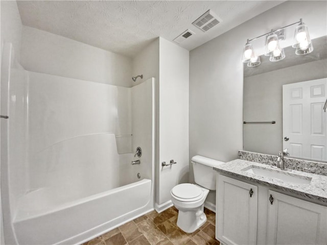 full bathroom featuring toilet, a textured ceiling, shower / washtub combination, and vanity