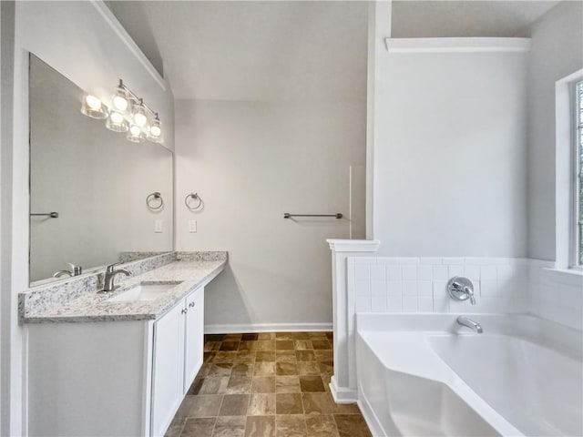 bathroom featuring vanity and a tub