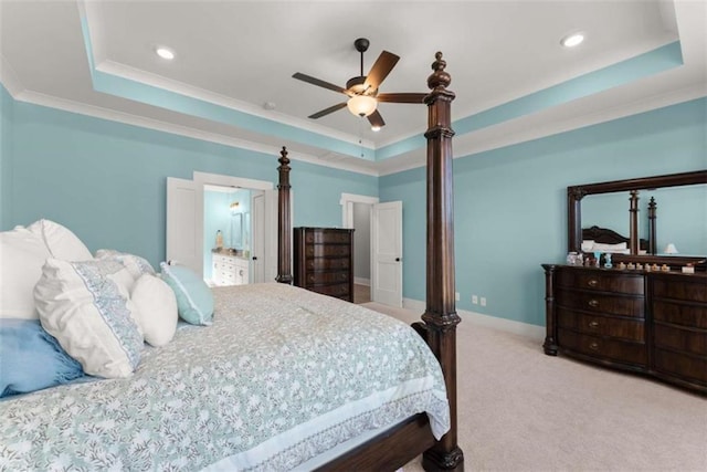 bedroom with a ceiling fan, baseboards, a tray ceiling, carpet, and crown molding