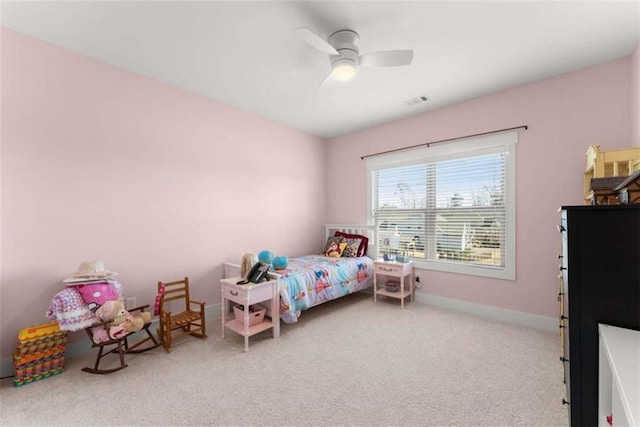 bedroom featuring ceiling fan, visible vents, baseboards, and carpet flooring