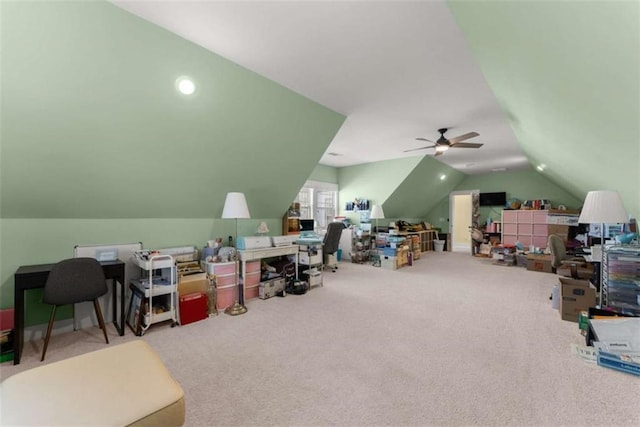 carpeted office with a ceiling fan and lofted ceiling