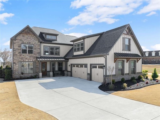 view of front of property with driveway, metal roof, roof with shingles, an attached garage, and a standing seam roof