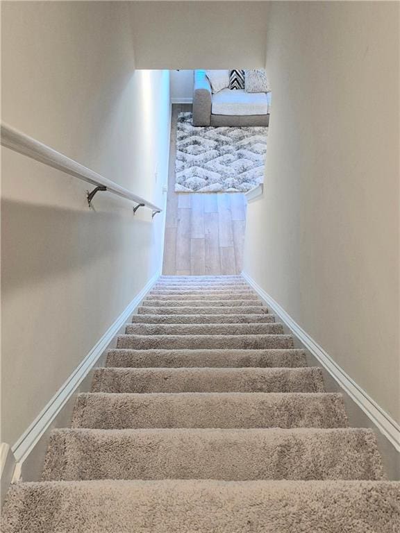 stairway with wood-type flooring