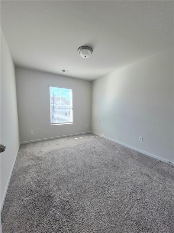 empty room featuring carpet flooring