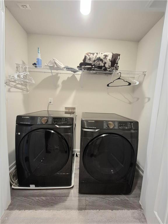 laundry room with washer and clothes dryer