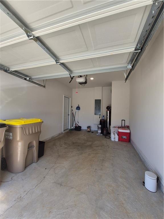 garage with electric panel and a garage door opener