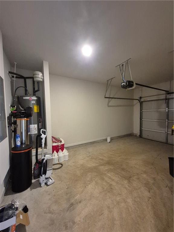 garage featuring electric water heater and a garage door opener