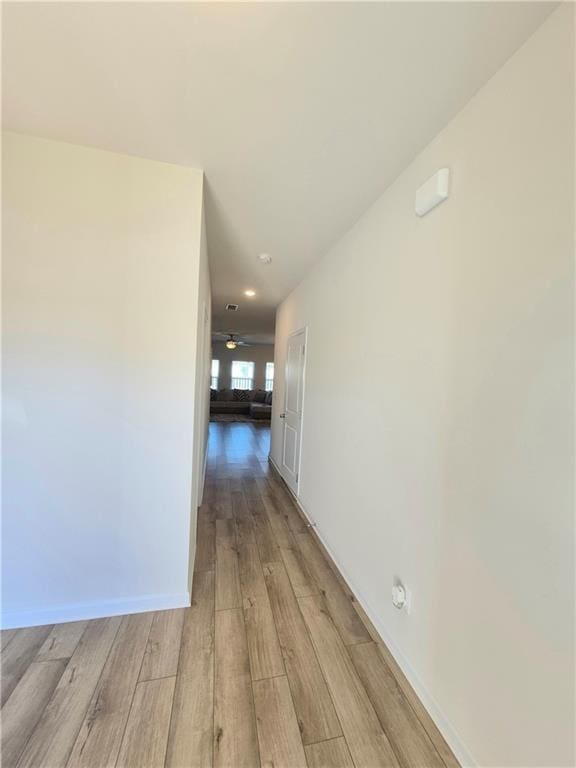 hallway with light wood-type flooring