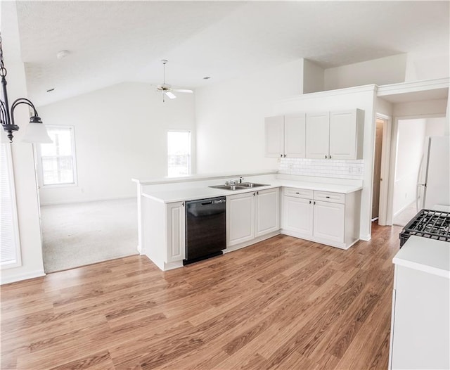 kitchen with white cabinetry, white refrigerator, dishwasher, range with gas stovetop, and backsplash