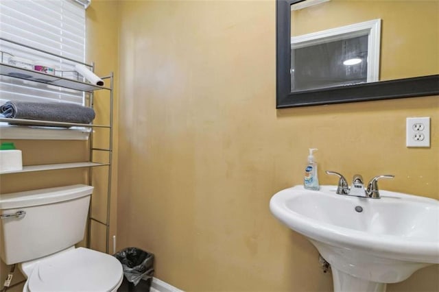 bathroom with a sink and toilet