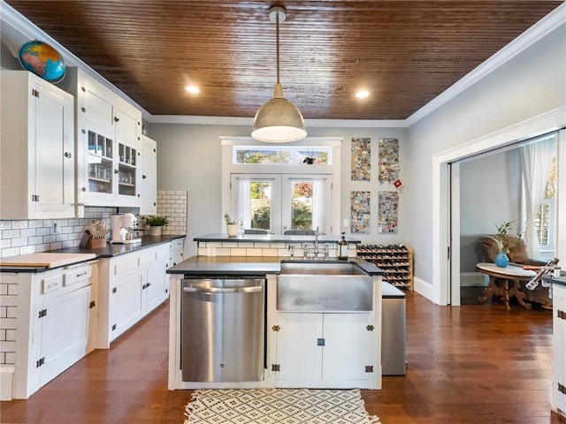 kitchen featuring dishwasher, decorative light fixtures, white cabinetry, and dark hardwood / wood-style floors