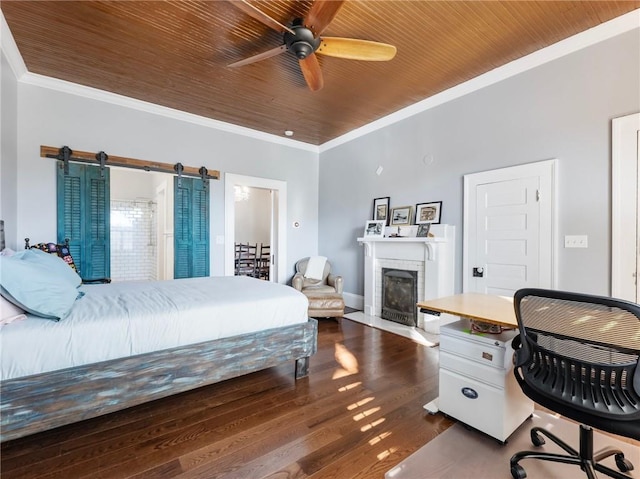 bedroom with ceiling fan, dark wood-type flooring, wooden ceiling, a barn door, and ornamental molding