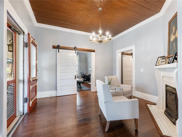 sitting room featuring a barn door, wood ceiling, and dark hardwood / wood-style floors