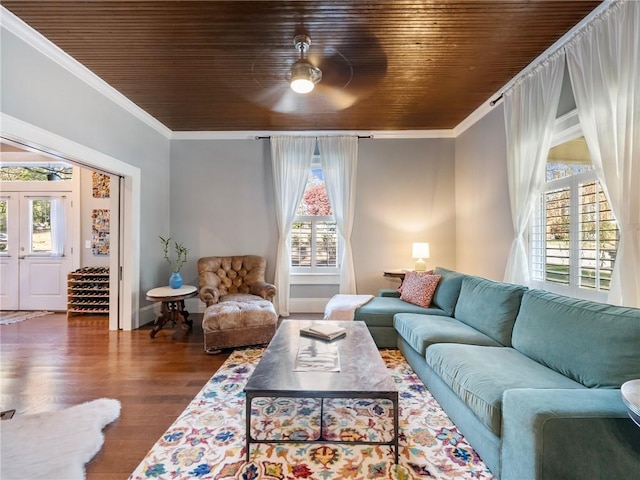 living room with dark hardwood / wood-style flooring, wood ceiling, and a wealth of natural light