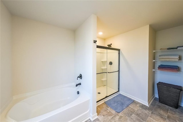 249 Creekview Way, Dallas, GA 30132 - bathroom featuring a shower stall, a garden tub, and baseboards