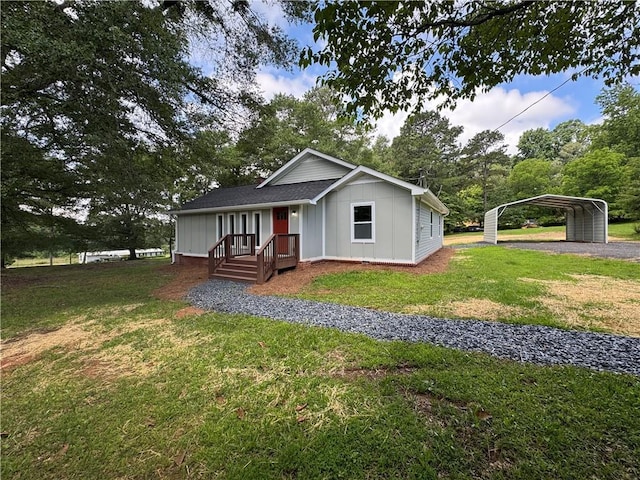 8245 Pleasant Grove Cir, Gainesville, GA 30506 - ranch-style home featuring board and batten siding, a front yard, a detached carport, driveway, and view of scattered trees