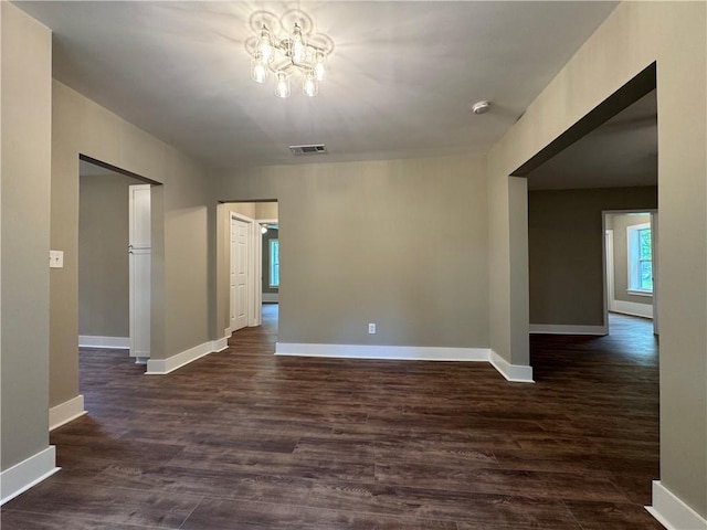 8245 Pleasant Grove Cir, Gainesville, GA 30506 - unfurnished room with a chandelier, dark wood finished floors, baseboards, and a smoke detector