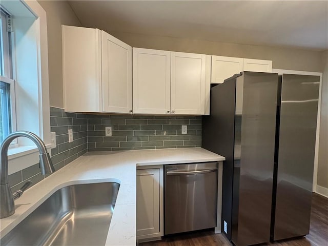 8245 Pleasant Grove Cir, Gainesville, GA 30506 - kitchen with stainless steel dishwasher, a sink, white cabinets, and light countertops