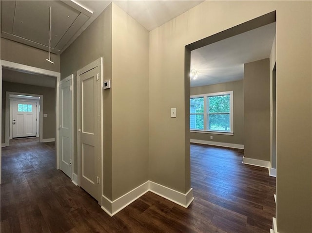 8245 Pleasant Grove Cir, Gainesville, GA 30506 - hallway with attic access, dark wood finished floors, healthy amount of natural light, and baseboards