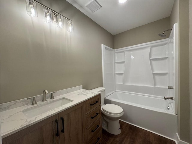 8245 Pleasant Grove Cir, Gainesville, GA 30506 - bathroom featuring wood finished floors, toilet, vanity, and shower / bathtub combination