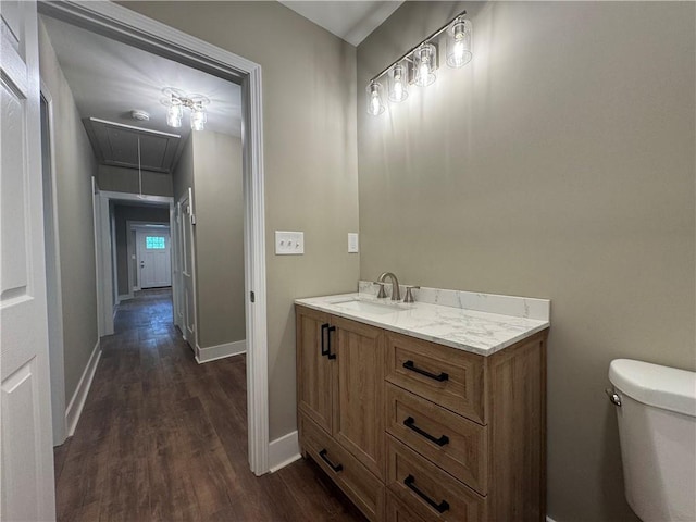 8245 Pleasant Grove Cir, Gainesville, GA 30506 - bathroom featuring wood finished floors, toilet, baseboards, and vanity