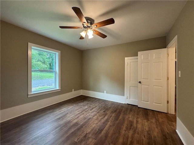 8245 Pleasant Grove Cir, Gainesville, GA 30506 - unfurnished bedroom featuring dark wood-type flooring, baseboards, and ceiling fan