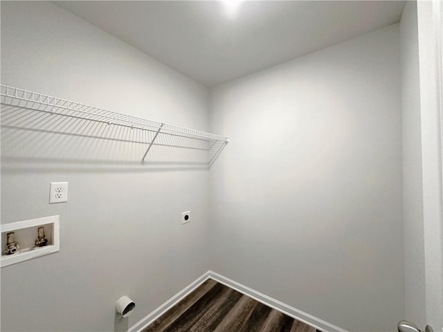 laundry area featuring dark wood-style floors, hookup for a washing machine, hookup for an electric dryer, laundry area, and baseboards