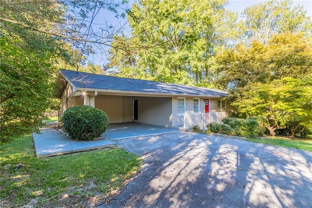 view of front of house with a carport