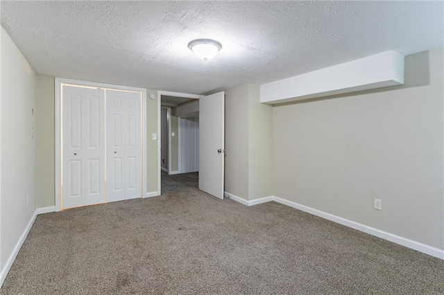 unfurnished bedroom with a closet, carpet, and a textured ceiling