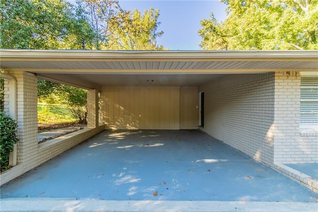 view of vehicle parking with a carport