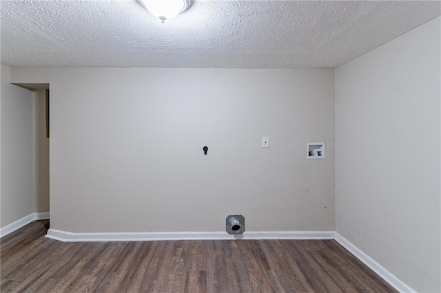 washroom featuring hookup for an electric dryer, hookup for a washing machine, a textured ceiling, and dark hardwood / wood-style flooring