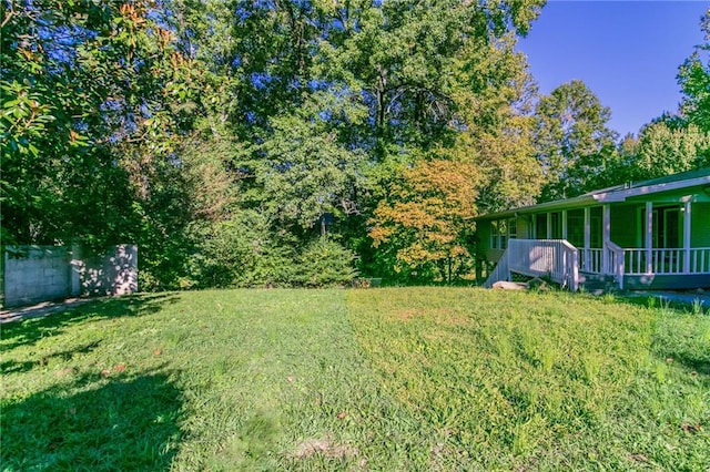 view of yard with a wooden deck