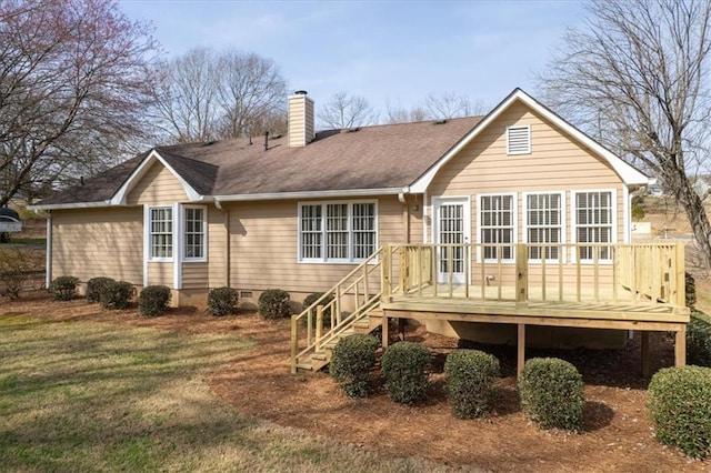 back of property with a wooden deck, crawl space, a chimney, and roof with shingles