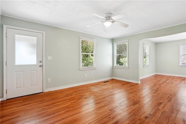 1891 8th St, Atlanta, GA 30341 - entryway with crown molding, light wood-style floors, ceiling fan, and baseboards