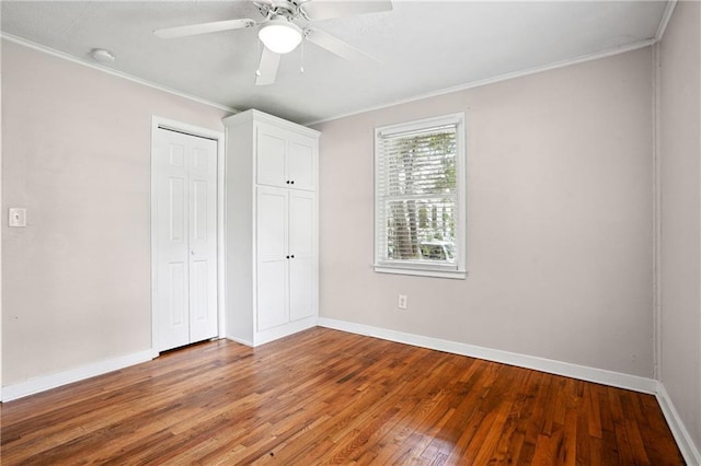 1891 8th St, Atlanta, GA 30341 - unfurnished bedroom with baseboards, hardwood / wood-style flooring, ornamental molding, a closet, and a ceiling fan